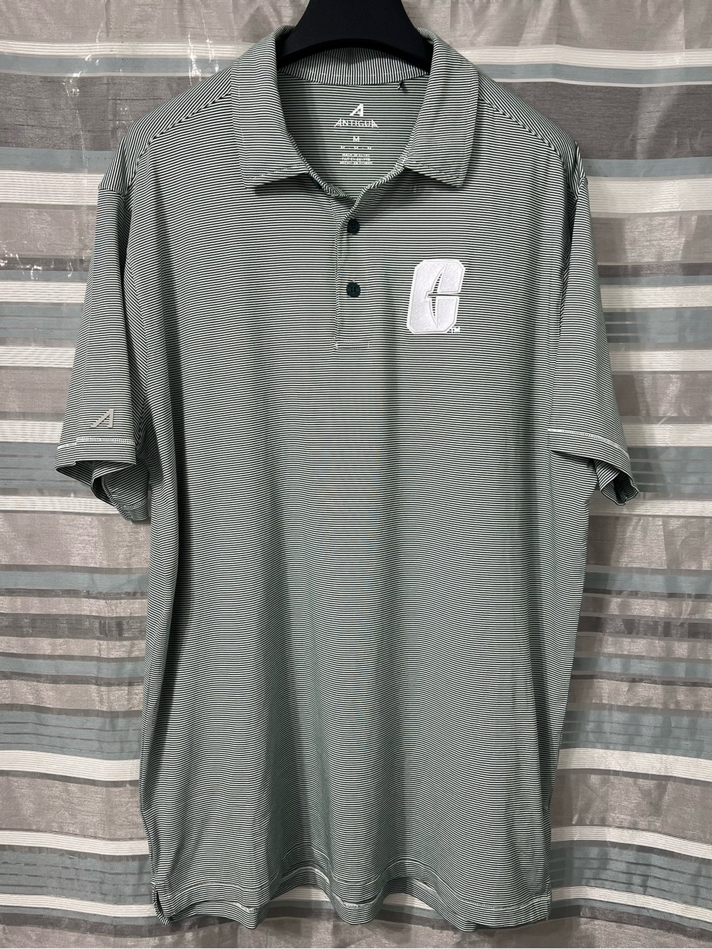 Antigua UNC Charlotte 49ers Men's Performance Polo in Green and White Striped